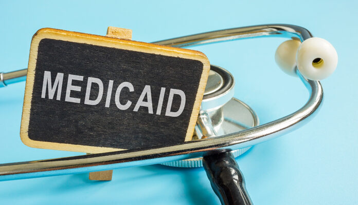 Plate with word Medicaid and a stethoscope.